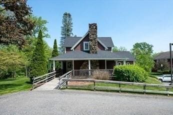 75 Orchard Meadow Dr Unit 75, Shrewsbury, MA 01545 - view of front of house featuring fence and covered porch
