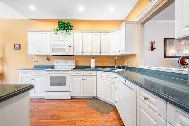 75 Orchard Meadow Dr Unit 75, Shrewsbury, MA 01545 - kitchen with white cabinetry, white appliances, light wood finished floors, and a sink