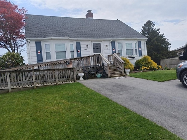 60 Academy Dr, Bourne, MA 02532 - view of front facade with a chimney and a shingled roof