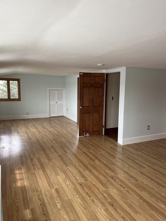 60 Academy Dr, Bourne, MA 02532 - spare room featuring baseboards, light wood finished floors, and lofted ceiling