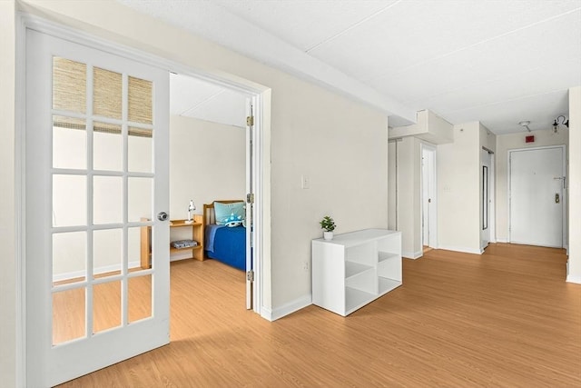 32 Whites Ave Unit F6605, Watertown, MA 02472 - hallway featuring light wood-style floors and baseboards