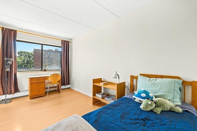 32 Whites Ave Unit F6605, Watertown, MA 02472 - bedroom featuring wood finished floors and baseboard heating