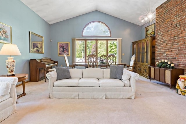 carpeted living room featuring high vaulted ceiling