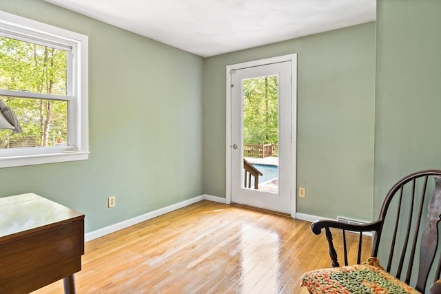 entryway featuring plenty of natural light and baseboards