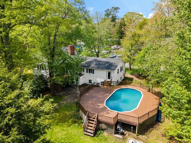 view of swimming pool with a deck