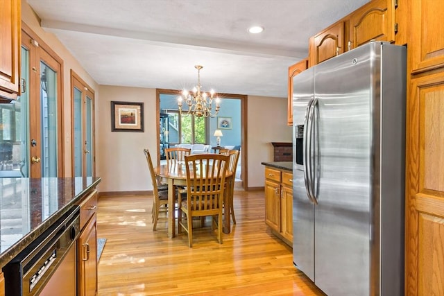 dining room with light wood-style flooring, a chandelier, baseboards, and recessed lighting