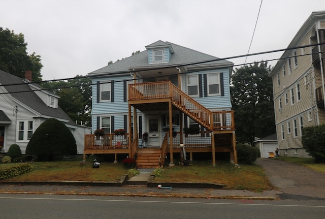 view of front of house featuring an outdoor structure and a garage