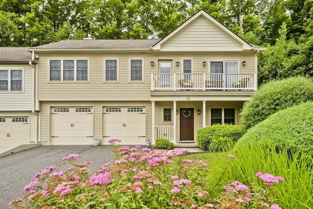 717 Northampton St Unit 41, Holyoke, MA 01040 - view of front of house featuring a balcony, driveway, and a garage