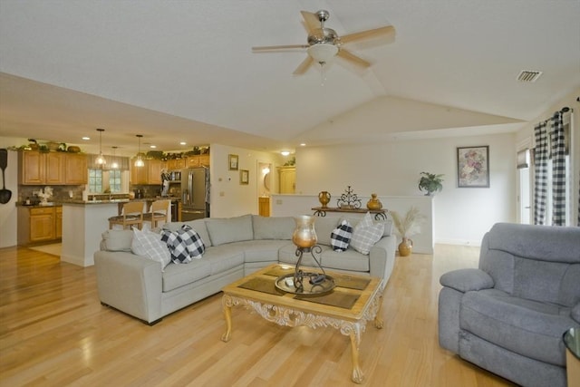 717 Northampton St Unit 41, Holyoke, MA 01040 - living room featuring a ceiling fan, vaulted ceiling, and light wood-style flooring