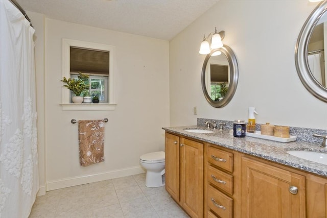 717 Northampton St Unit 41, Holyoke, MA 01040 - bathroom featuring double vanity and tile patterned flooring