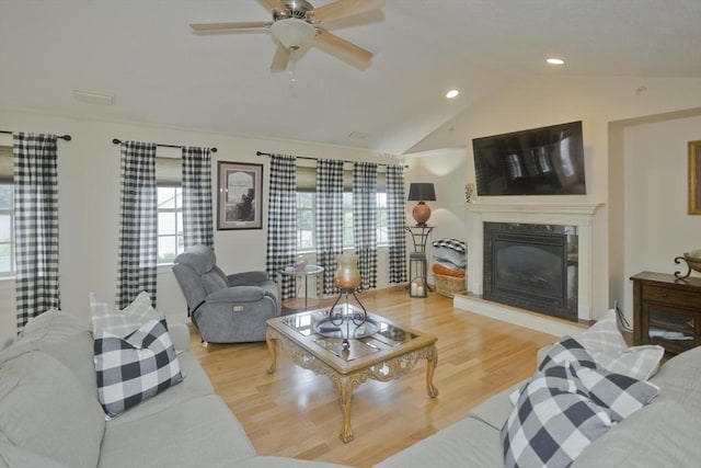 717 Northampton St Unit 41, Holyoke, MA 01040 - living area with lofted ceiling, wood finished floors, ceiling fan, a fireplace, and recessed lighting