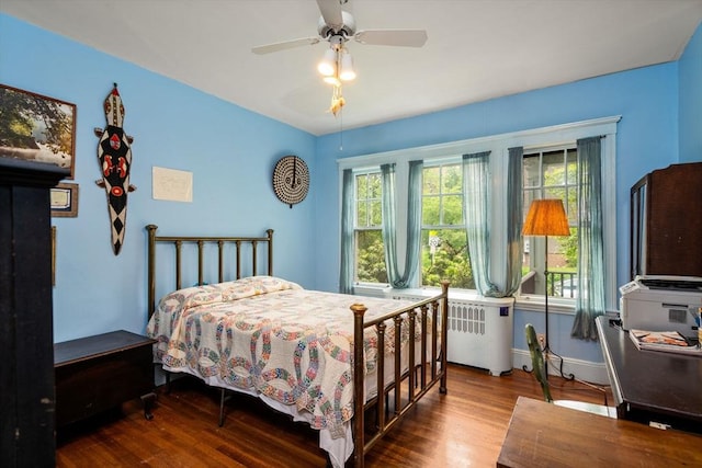97 Stearns Rd, Brookline, MA 02446 - bedroom featuring multiple windows, wood finished floors, radiator heating unit, and baseboards