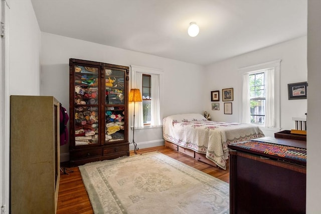 97 Stearns Rd, Brookline, MA 02446 - bedroom with dark wood-style flooring and baseboards