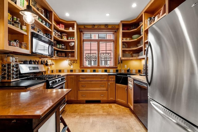 97 Stearns Rd, Brookline, MA 02446 - kitchen with stainless steel appliances, open shelves, a sink, recessed lighting, and wood counters