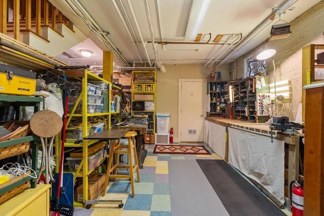 97 Stearns Rd, Brookline, MA 02446 - interior space with tile patterned floors and a workshop area