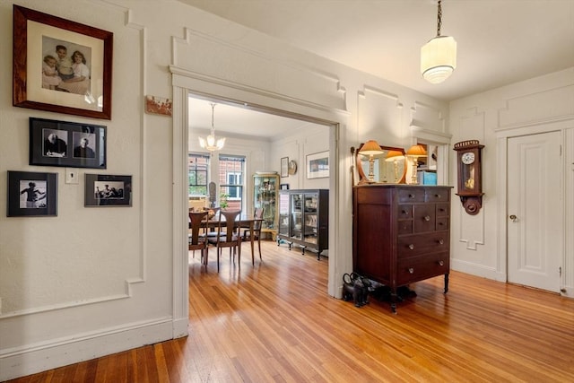 97 Stearns Rd, Brookline, MA 02446 - foyer featuring a chandelier, wood finished floors, and baseboards