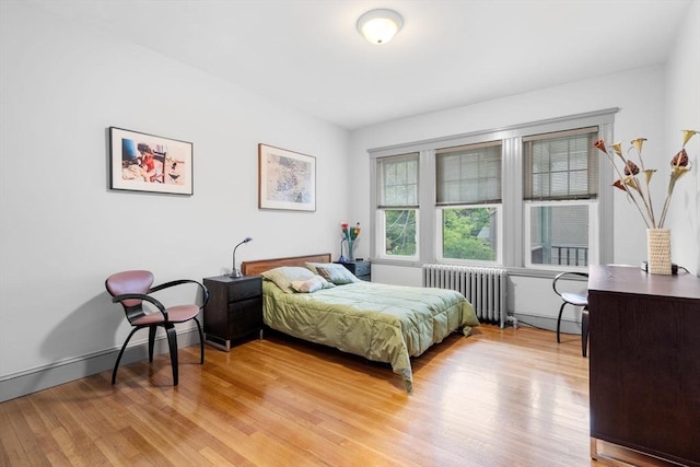 97 Stearns Rd, Brookline, MA 02446 - bedroom featuring radiator and light wood-type flooring