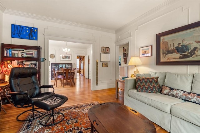 97 Stearns Rd, Brookline, MA 02446 - living room featuring wood finished floors, crown molding, and a chandelier