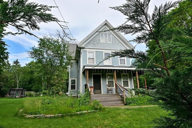 217 Asbury St, Hamilton, MA 01982 - view of front of home with covered porch and a front yard
