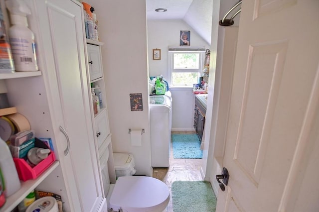 217 Asbury St, Hamilton, MA 01982 - bathroom featuring washer and clothes dryer, vaulted ceiling, and vanity
