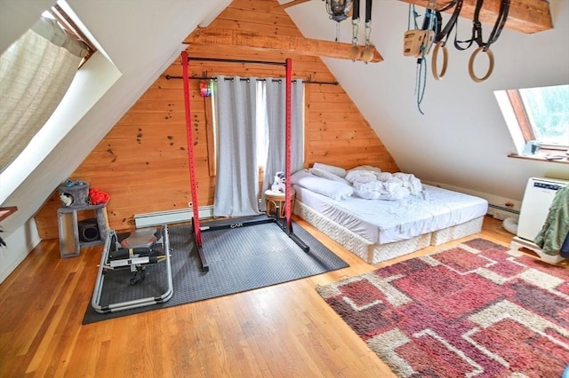 217 Asbury St, Hamilton, MA 01982 - bedroom with wood walls, baseboard heating, wood finished floors, and lofted ceiling