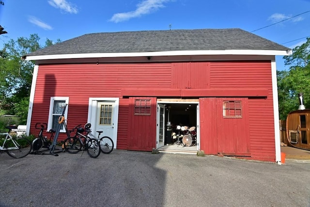 217 Asbury St, Hamilton, MA 01982 - back of house with an outbuilding and roof with shingles