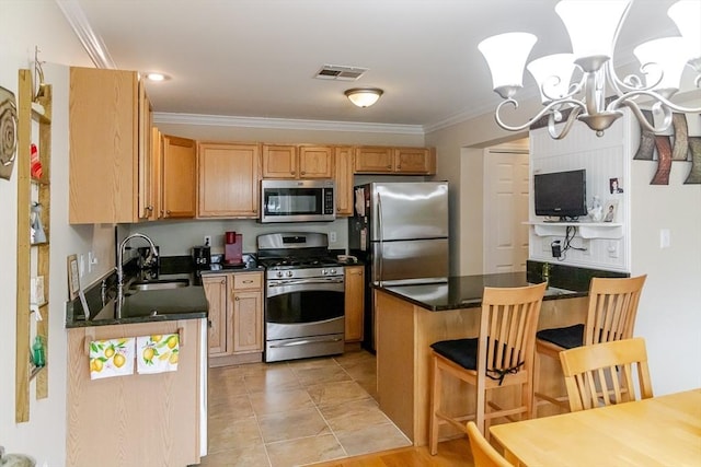 kitchen featuring crown molding, visible vents, dark countertops, a sink, and stainless steel appliances