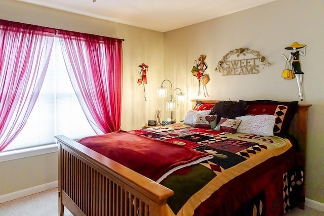 bedroom with baseboards and carpet flooring