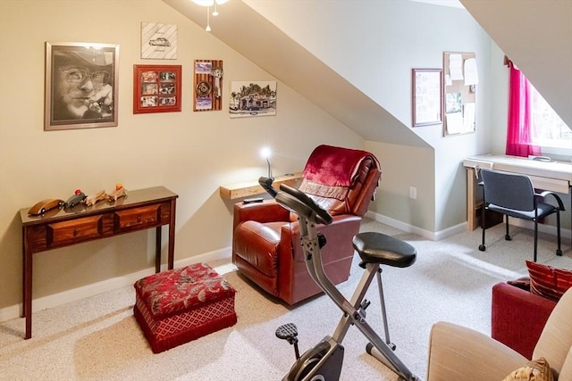 living area featuring baseboards and carpet