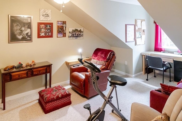 sitting room with baseboards and carpet