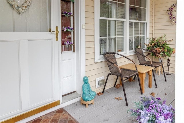 view of exterior entry featuring a porch