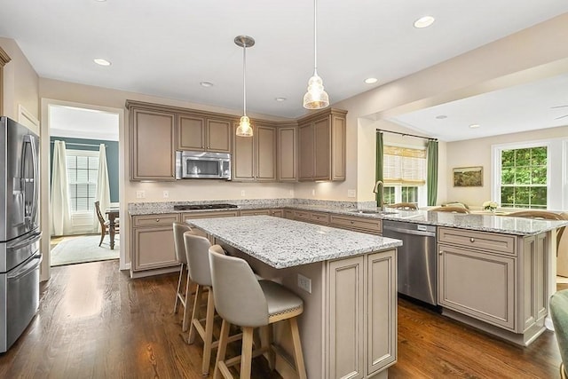 132 Hemmingway Pl, Wrentham, MA 02093 - kitchen featuring appliances with stainless steel finishes, a kitchen island, a sink, a peninsula, and a breakfast bar area