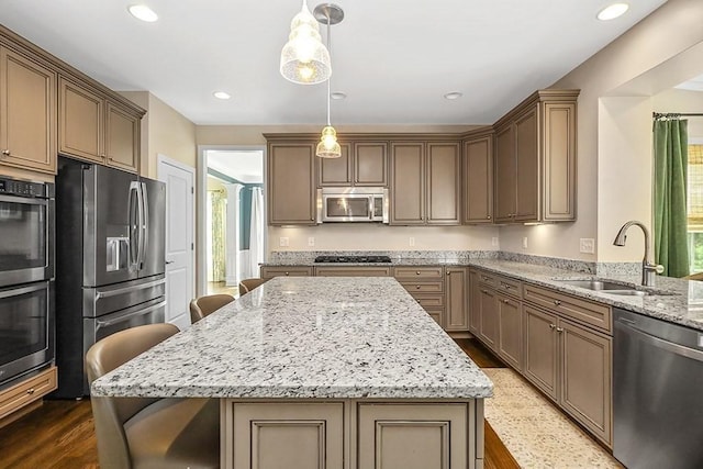 132 Hemmingway Pl, Wrentham, MA 02093 - kitchen featuring stainless steel appliances, a sink, healthy amount of natural light, light stone counters, and recessed lighting