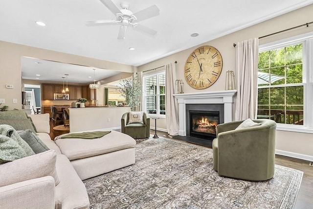 132 Hemmingway Pl, Wrentham, MA 02093 - living room featuring a fireplace with flush hearth, wood finished floors, recessed lighting, ceiling fan, and baseboards