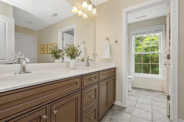 132 Hemmingway Pl, Wrentham, MA 02093 - full bath featuring double vanity, toilet, baseboards, and tile patterned flooring
