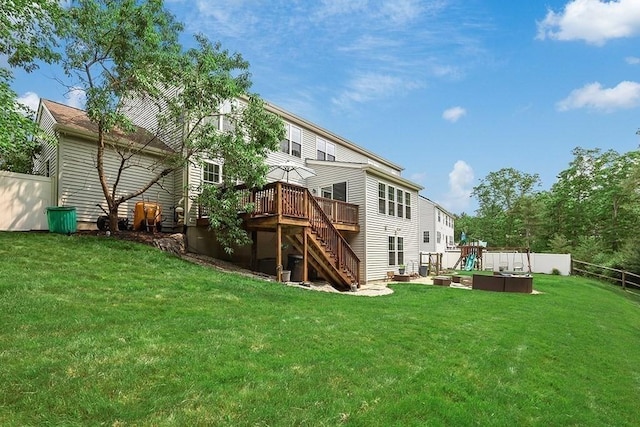 132 Hemmingway Pl, Wrentham, MA 02093 - back of property with stairway, a deck, and a playground