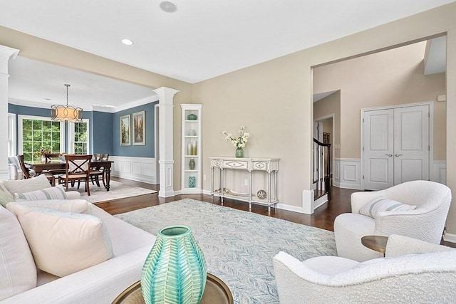 132 Hemmingway Pl, Wrentham, MA 02093 - living room featuring ornate columns, dark wood-style flooring, a decorative wall, a wainscoted wall, and recessed lighting