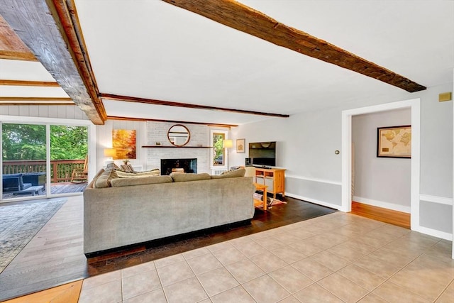 26 Beacon St, Amesbury, MA 01913 - living room with beam ceiling, wood finished floors, and a fireplace