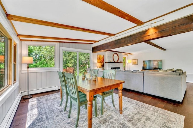 26 Beacon St, Amesbury, MA 01913 - dining space featuring healthy amount of natural light, beamed ceiling, wood-type flooring, and a fireplace