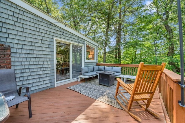 26 Beacon St, Amesbury, MA 01913 - wooden deck with an outdoor living space with a fire pit