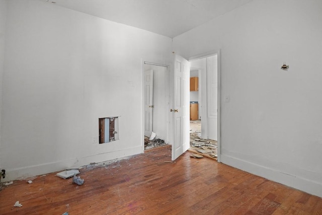 empty room featuring hardwood / wood-style flooring