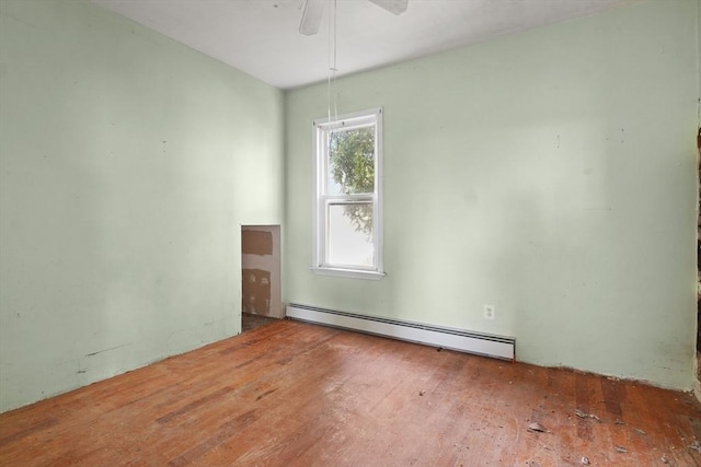 unfurnished room featuring baseboard heating, a healthy amount of sunlight, and ceiling fan