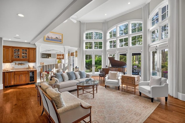 9 High Ridge Dr, Mattapoisett, MA 02739 - living room featuring wine cooler, french doors, recessed lighting, light wood-type flooring, and a high ceiling