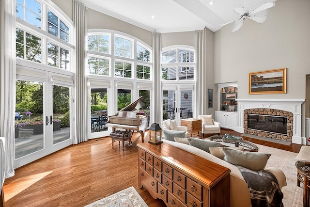 9 High Ridge Dr, Mattapoisett, MA 02739 - living room with french doors, a towering ceiling, wood finished floors, a fireplace, and crown molding