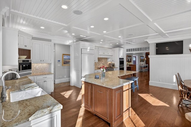 9 High Ridge Dr, Mattapoisett, MA 02739 - kitchen with decorative backsplash, dark wood finished floors, double oven, recessed lighting, and coffered ceiling