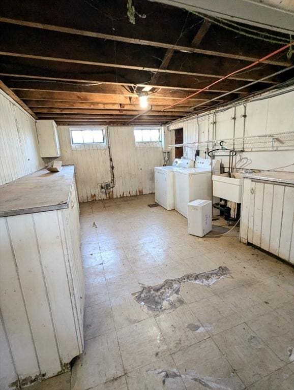 below grade area featuring washer and dryer
