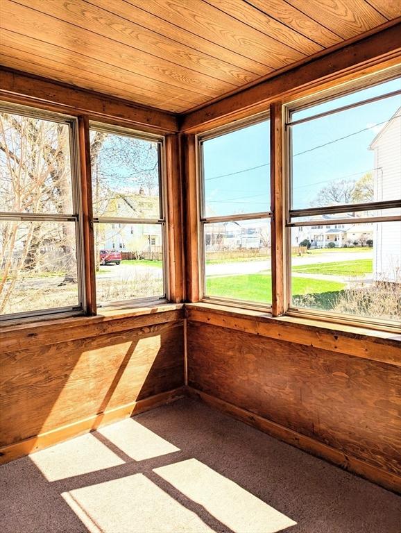 unfurnished sunroom with plenty of natural light