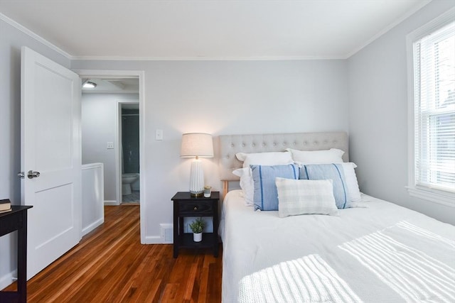 bedroom featuring crown molding, multiple windows, wood finished floors, and baseboards