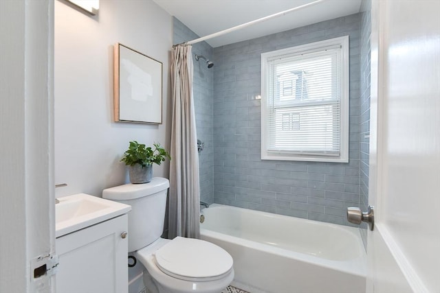 full bath featuring toilet, vanity, and shower / bath combination with curtain