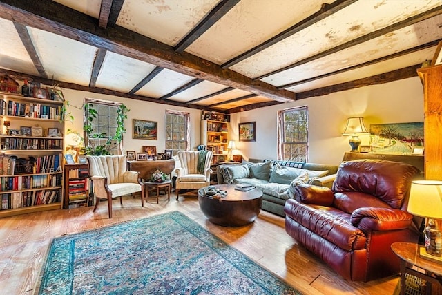 sitting room featuring hardwood / wood-style floors and beam ceiling